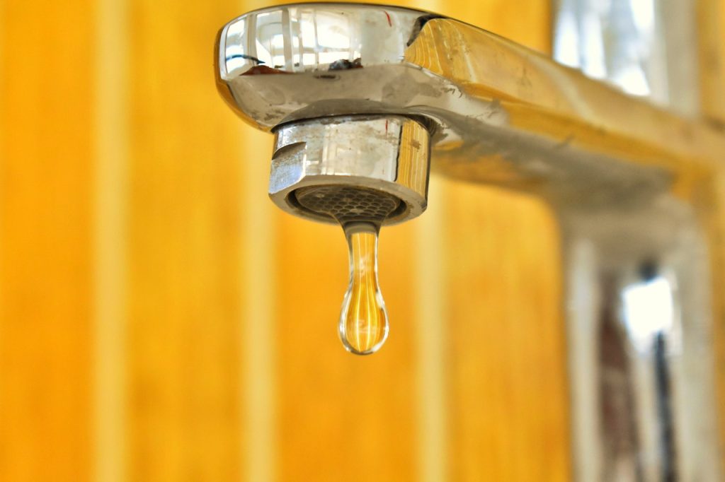 Polish your kitchen faucet and make it shiny with lemon citrus