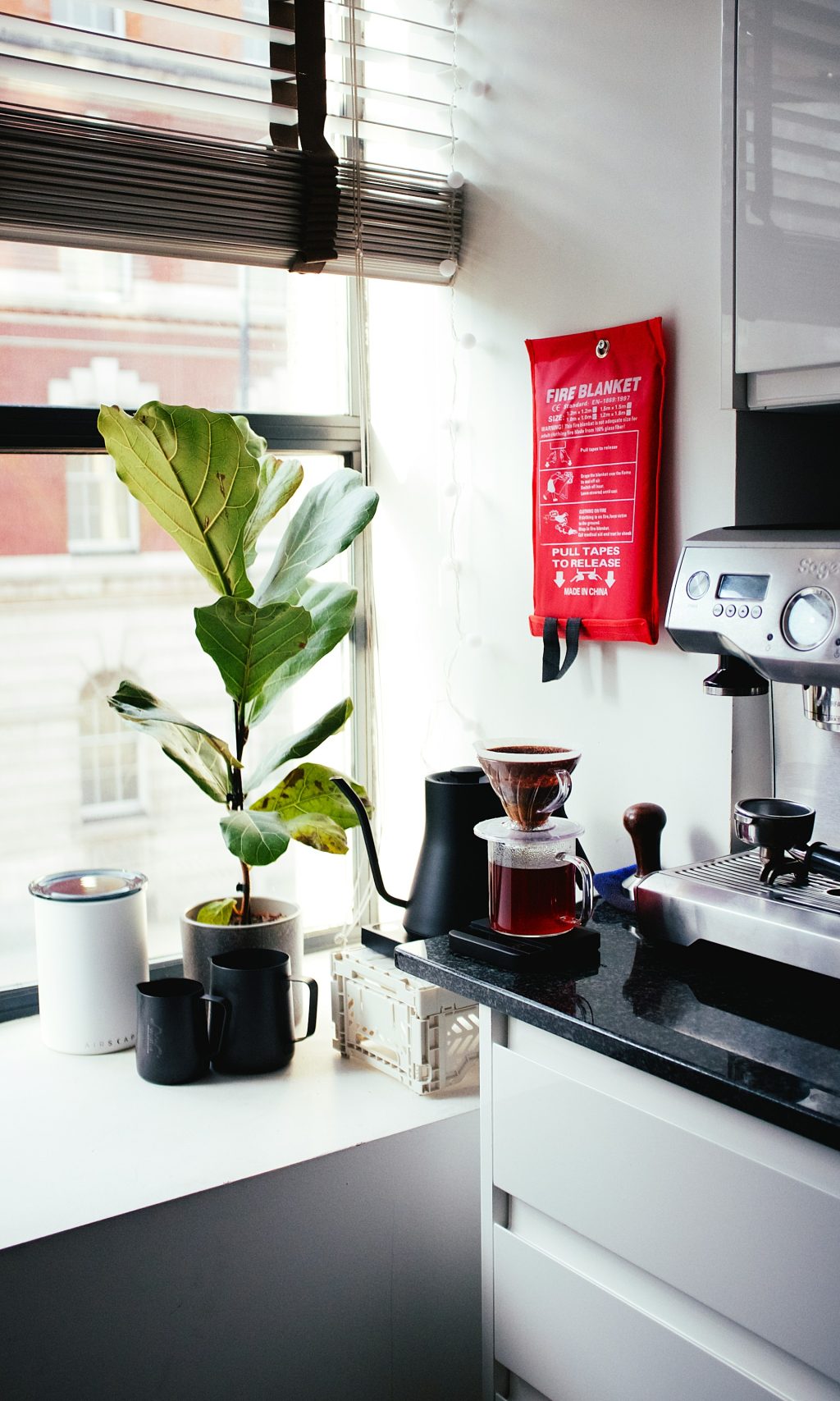 Arrange for a Home fire safety corner with extinguisher, smoke alarm, and fire blanket