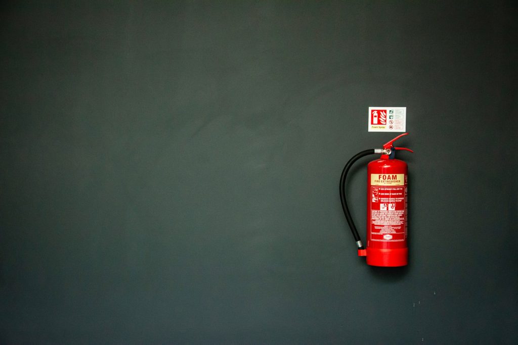 Easily accessible fire extinguisher positioned in a tidy Singapore living room—a simple step in making your home fire safe